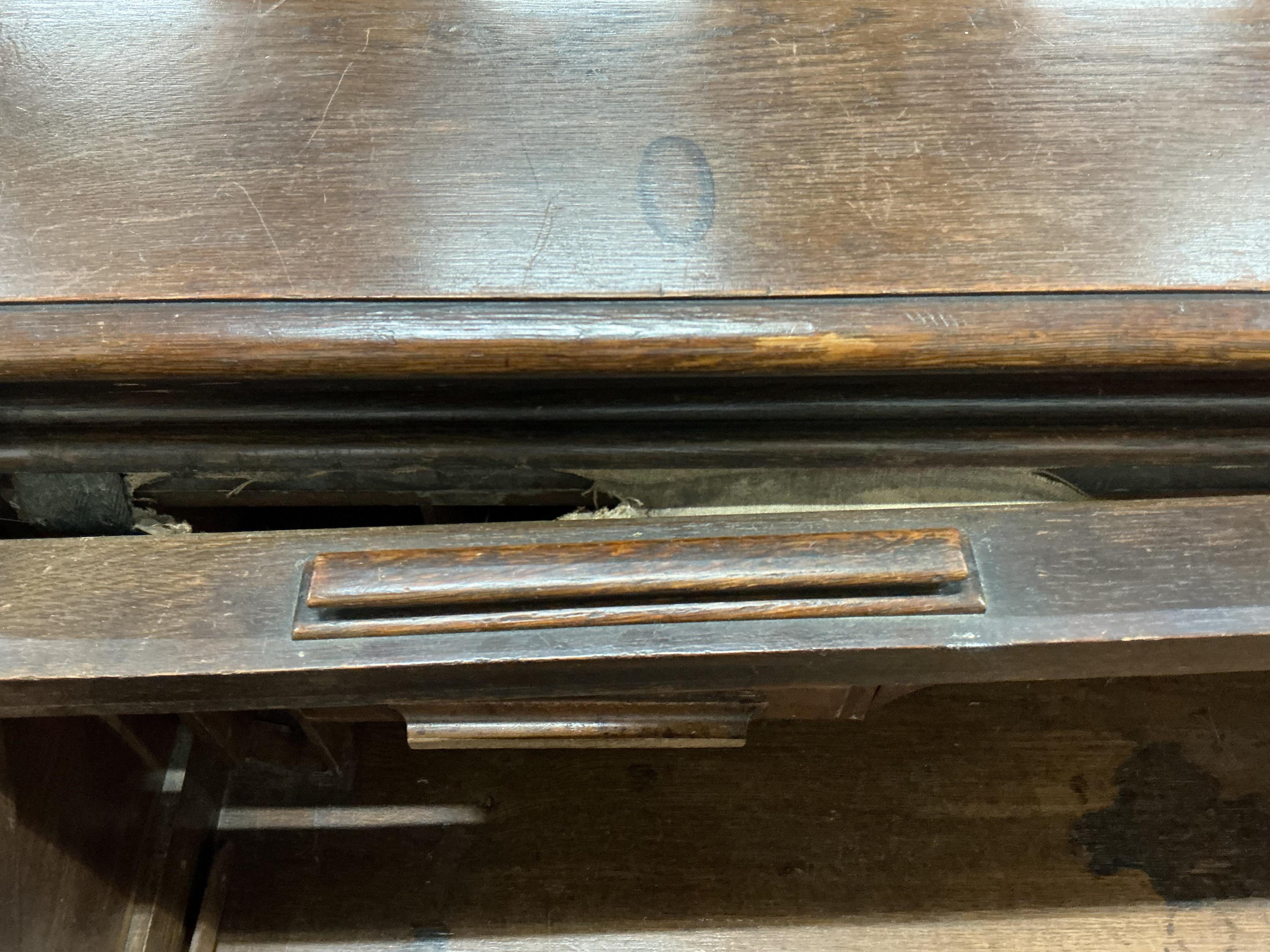 An early 20th century oak 'S' shaped tambour roll top desk, width 124cm, depth 78cm, height 120cm